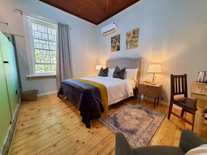 Main bedroom with wooden floors