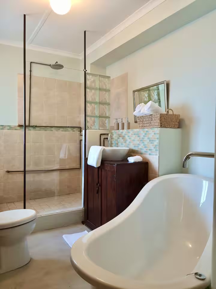 Guest bathroom with freestanding bath and shower